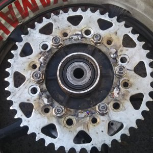 Hybrid sprocket mounted on wheel before attaching nuts